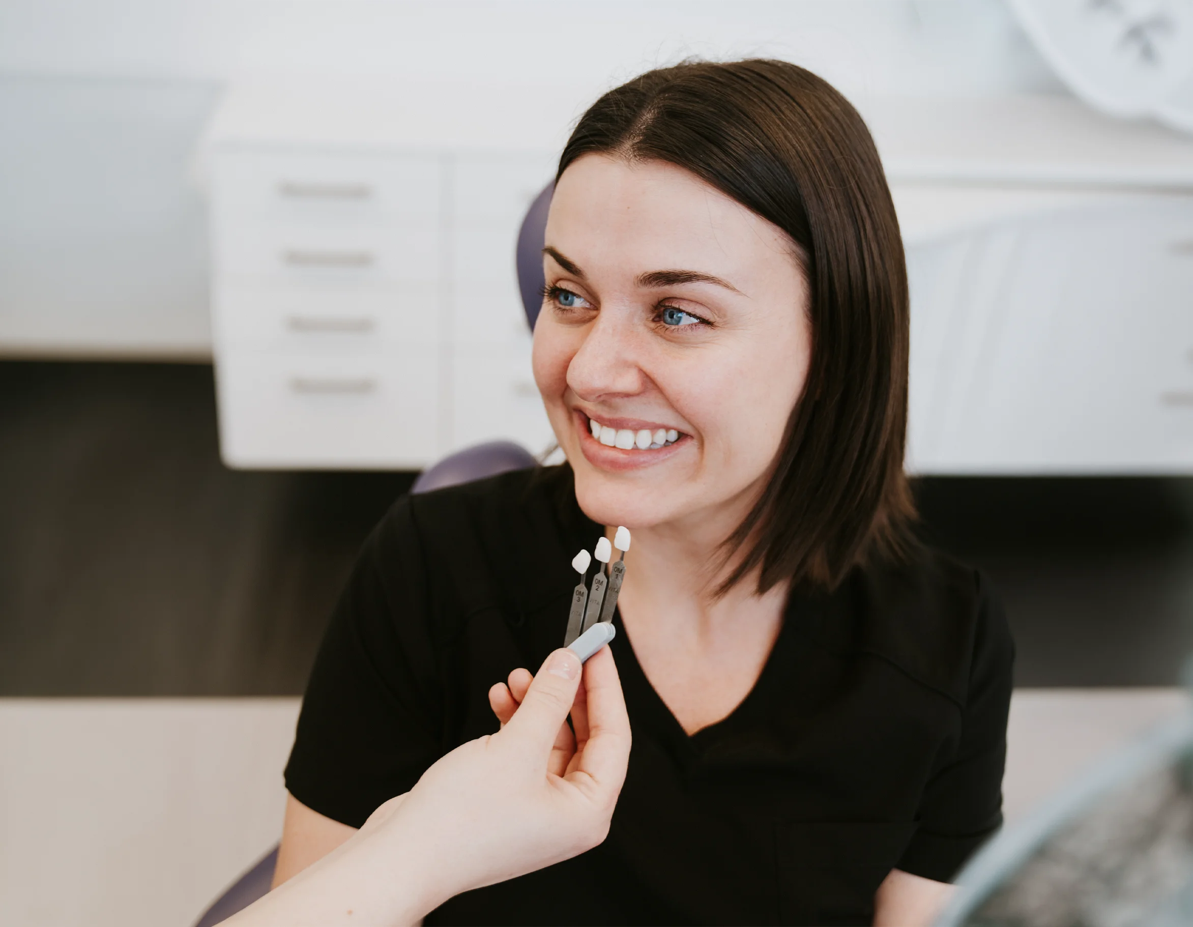 Smiling patient during a facial aesthetics consultation at Vivid Specialized Dentistry in Edmonton