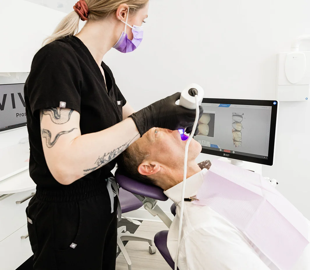 Hygienist taking an intraoral scan during a specialized cleaning visit
